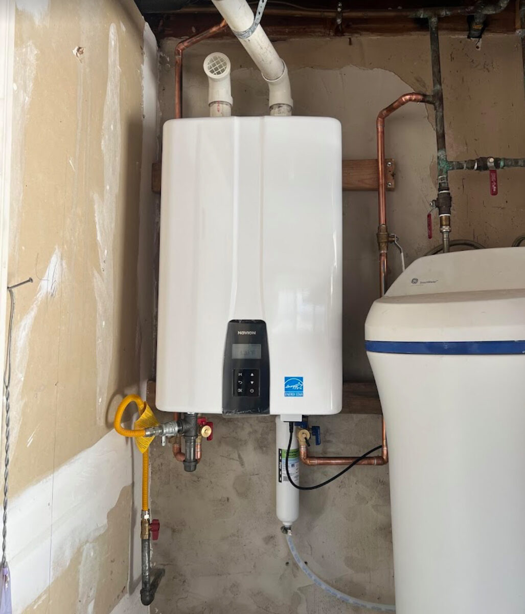 Navien tankless water heater installation in Pickering Ontario with copper piping and gas line by licensed HVAC technician